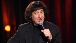 Emo Philips Biography 2026 – American comedian performing on stage
